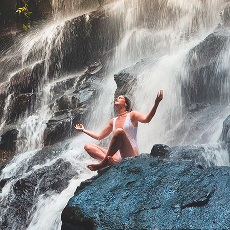 woman near waterfall - mindfulness 
